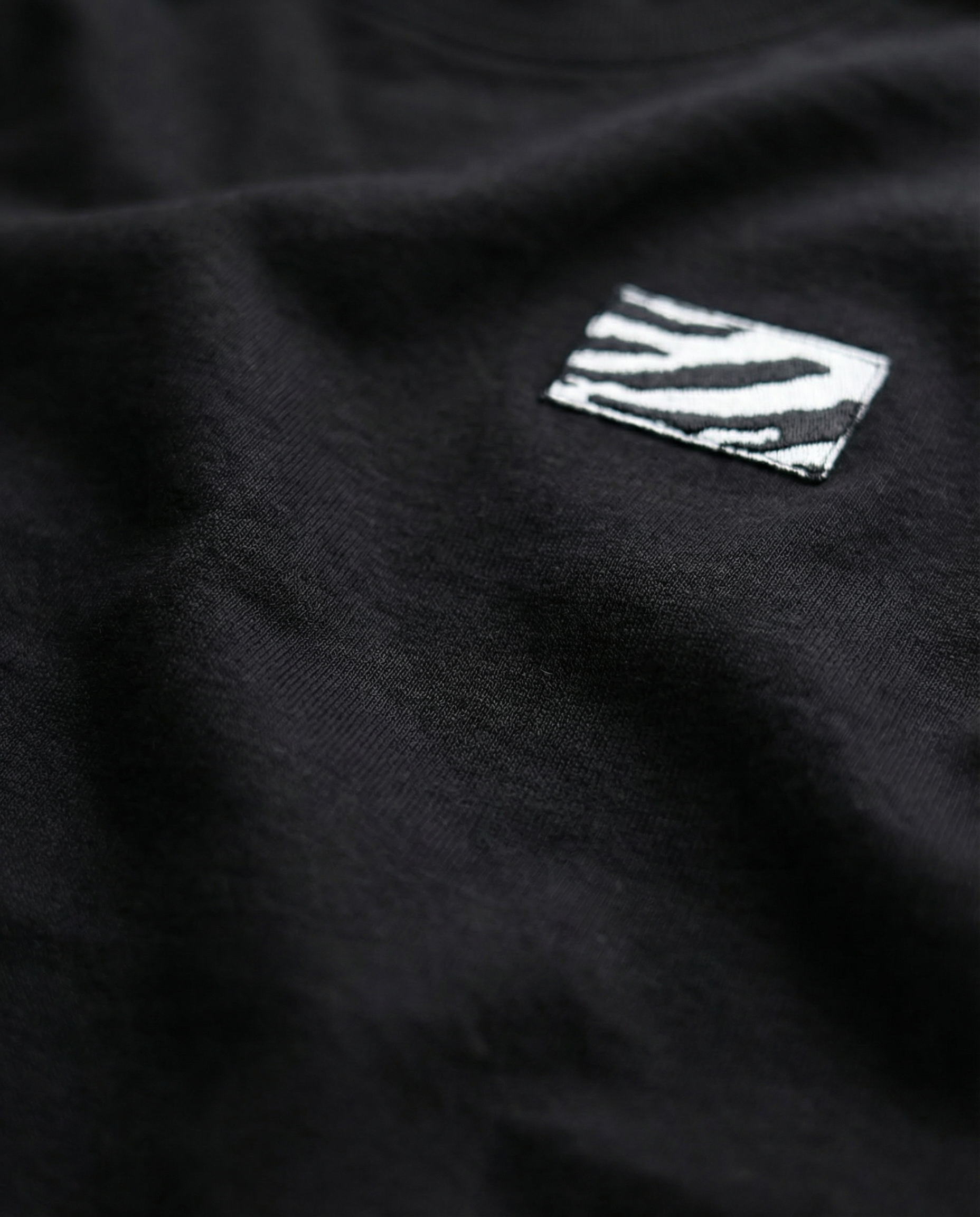 Black fabric with a zebra-striped label