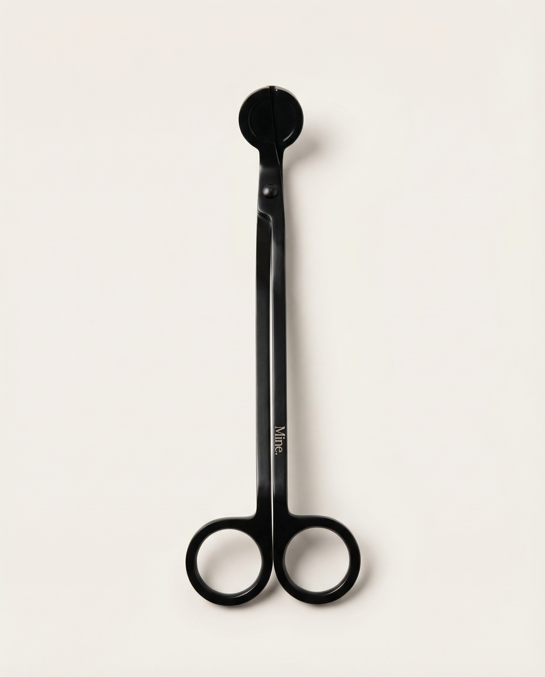 Black scissors with a visible brand logo on a white background