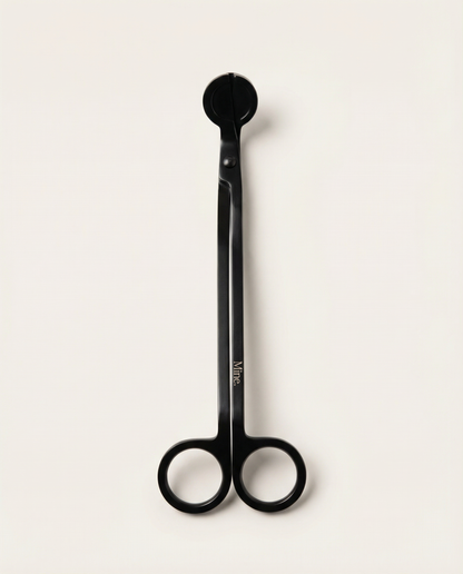 Black scissors with a visible brand logo on a white background