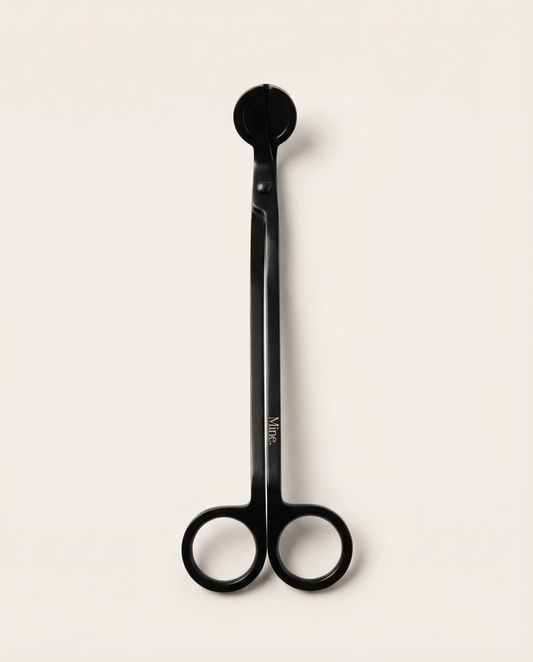 Black scissors with a visible brand logo on a white background